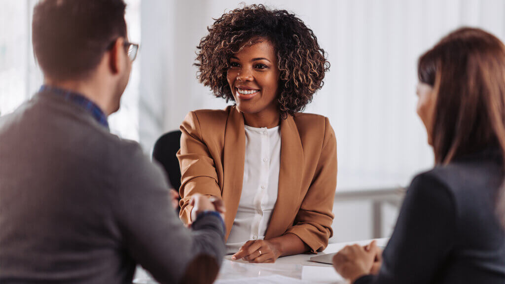 Business people shaking hands after meeting