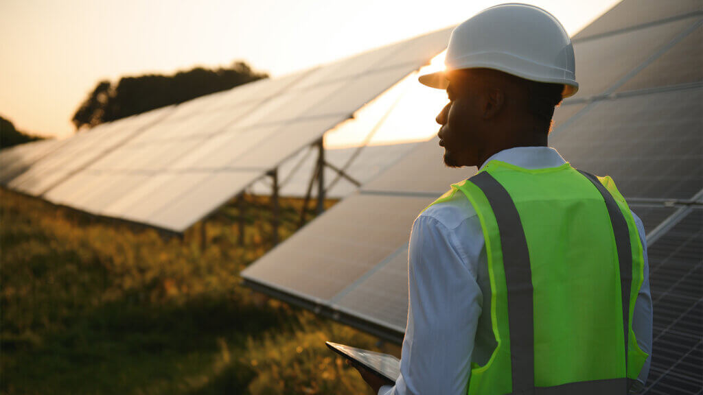 African american technician check the maintenance of the solar panels